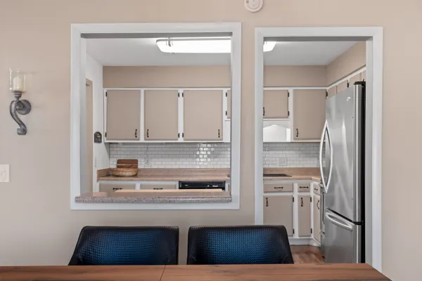 a bathroom with a sink a mirror and shower