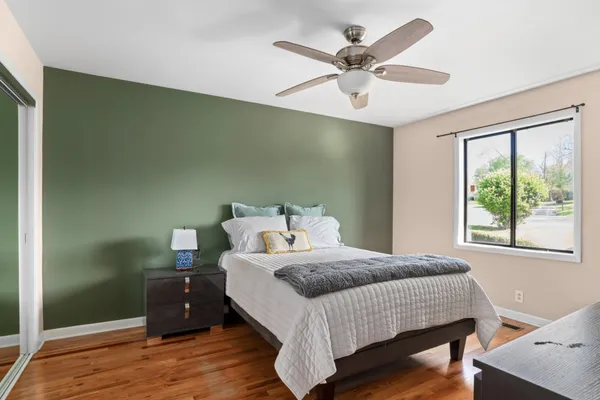 a bedroom with a bed and window