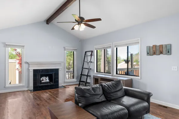 a living room with furniture and a fireplace