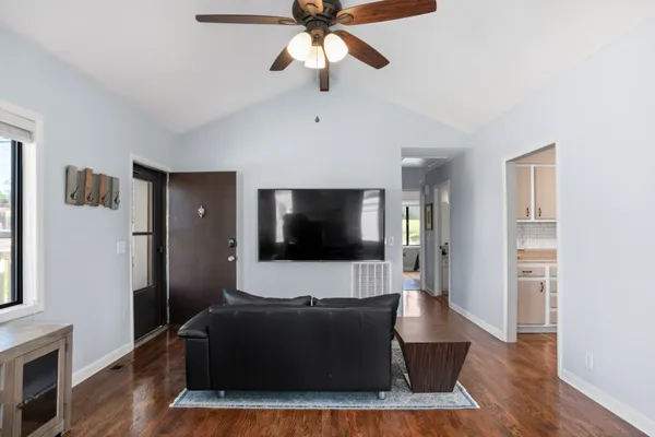 a living room with furniture and a flat screen tv