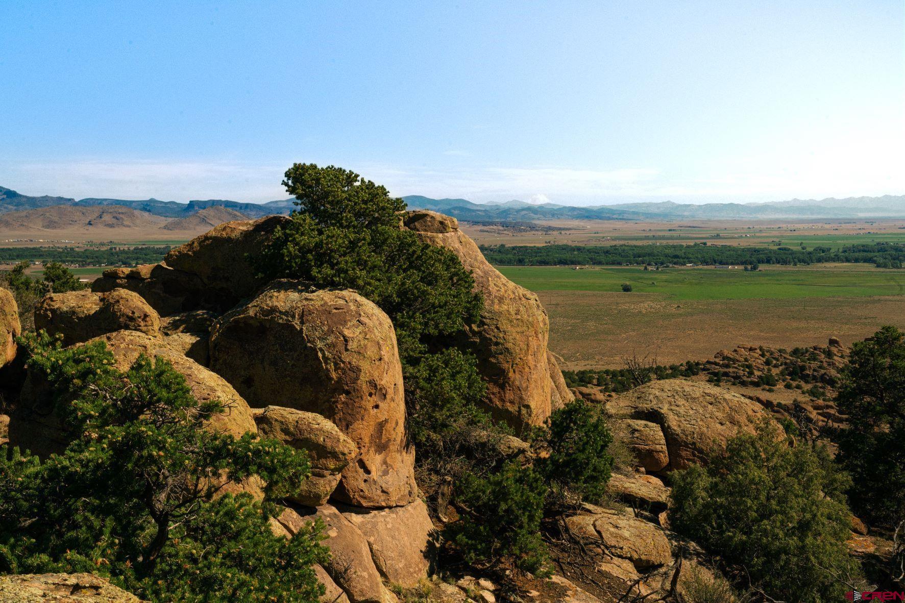 42 Wapiti Ridge Road Del Norte, CO 81132 - Photo 7 of 9 a view of a lake with a mountain in the background
