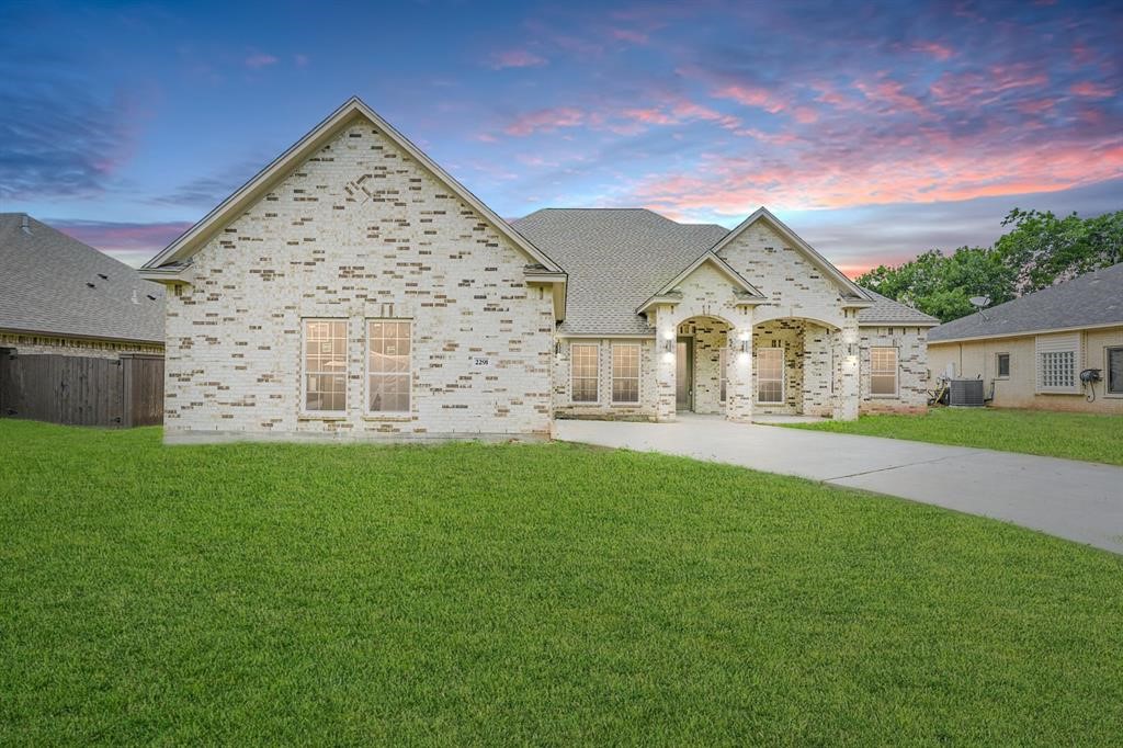 2291 Riverside Drive West Columbia, TX 77486 - Photo 17 of 50 front view of a house with a yard