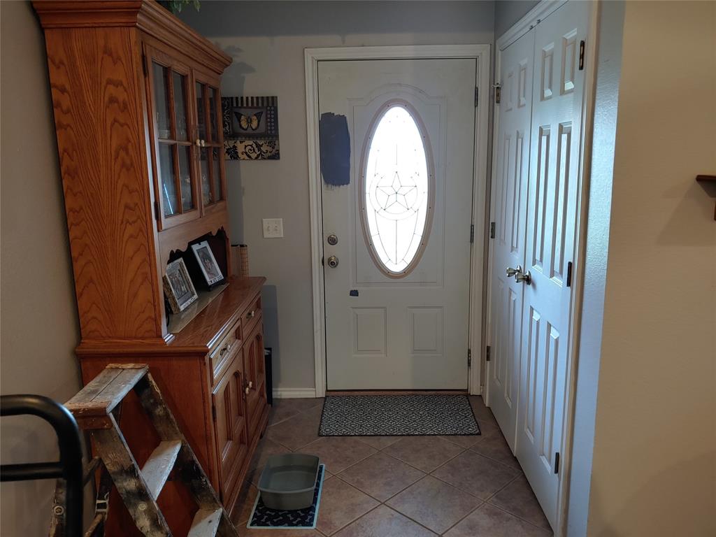 84 County Road Sumner, TX 75486 - Photo 11 of 33 a view of a entryway with wooden floor