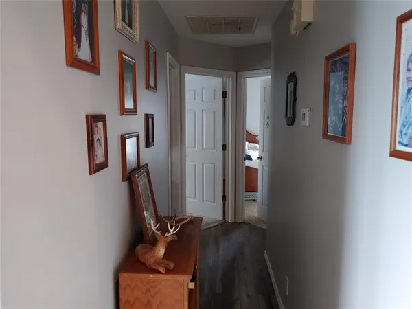 a room with furniture and a book shelf