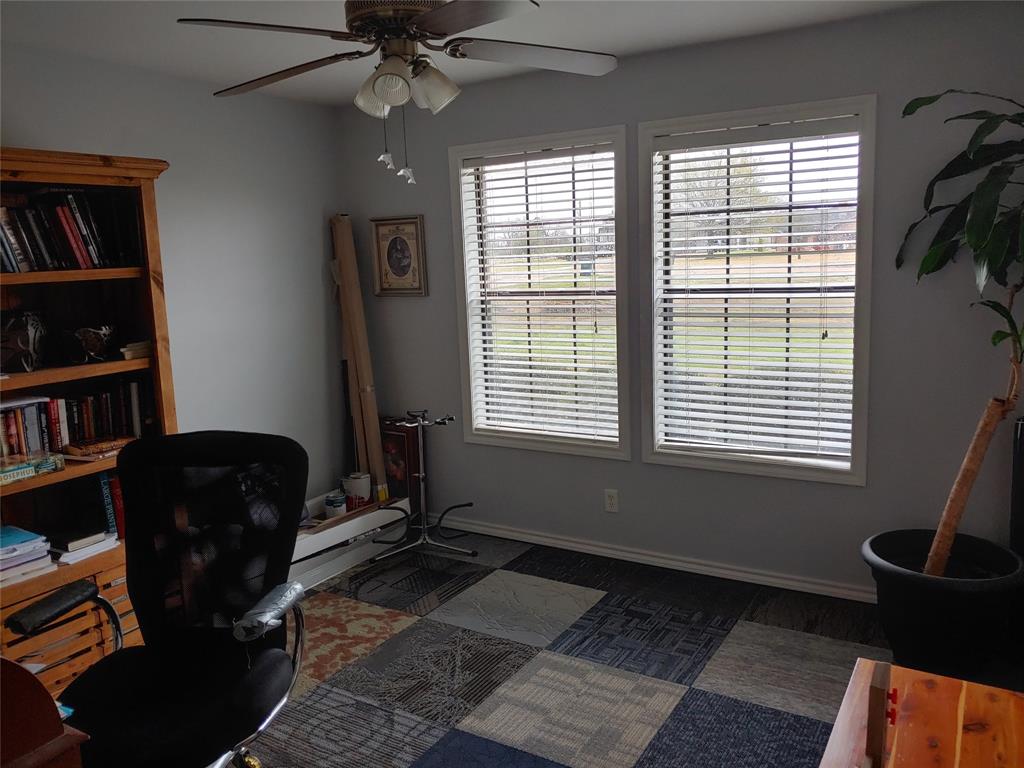 84 County Road Sumner, TX 75486 - Photo 13 of 33 a room with furniture and a book shelf