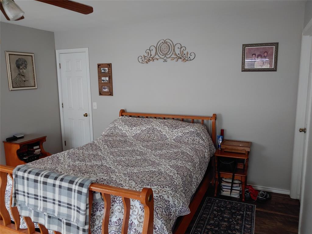 84 County Road Sumner, TX 75486 - Photo 19 of 33 a bedroom with bed and wooden floor