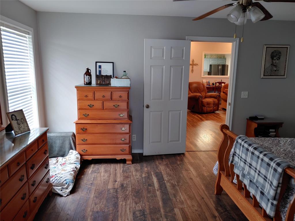 84 County Road Sumner, TX 75486 - Photo 20 of 33 a room with furniture and wooden floor