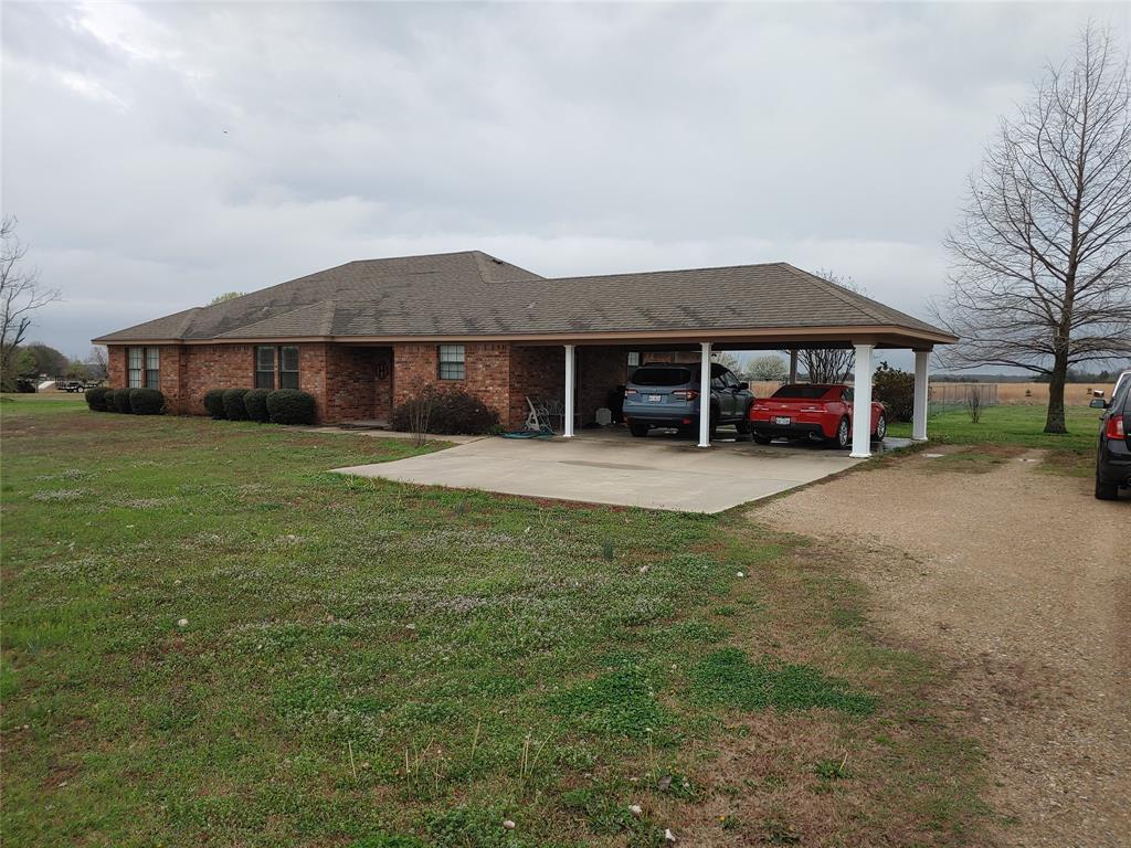84 County Road Sumner, TX 75486 - Photo 25 of 33 a view of a house with a yard and sitting area