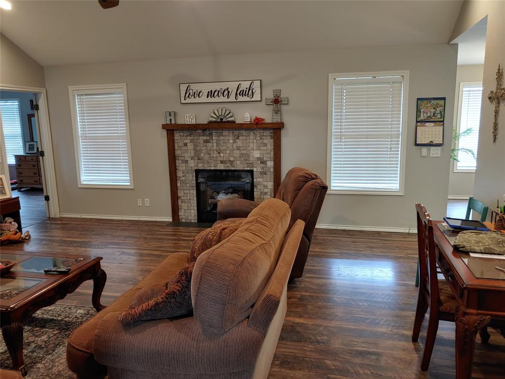 84 County Road Sumner, TX 75486 - Photo 9 of 33 a living room with furniture and a fireplace