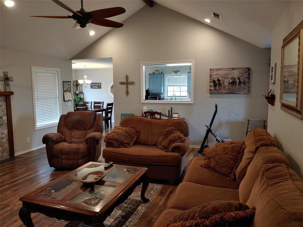 84 County Road Sumner, TX 75486 - Photo 10 of 33 a living room with furniture a ceiling fan and a rug