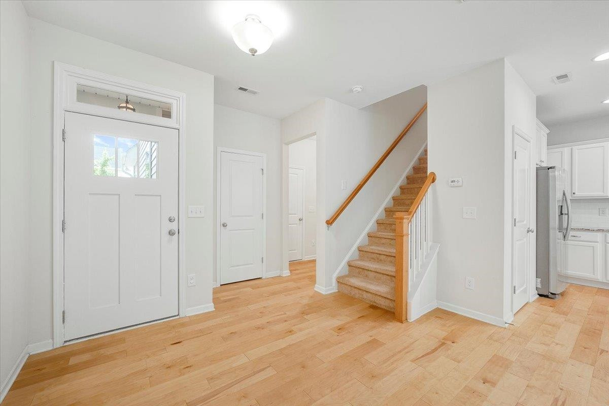 Plenty of elbow room when you enter with a coat closet and a seperate area for the garage entrance and half bath. Entrance