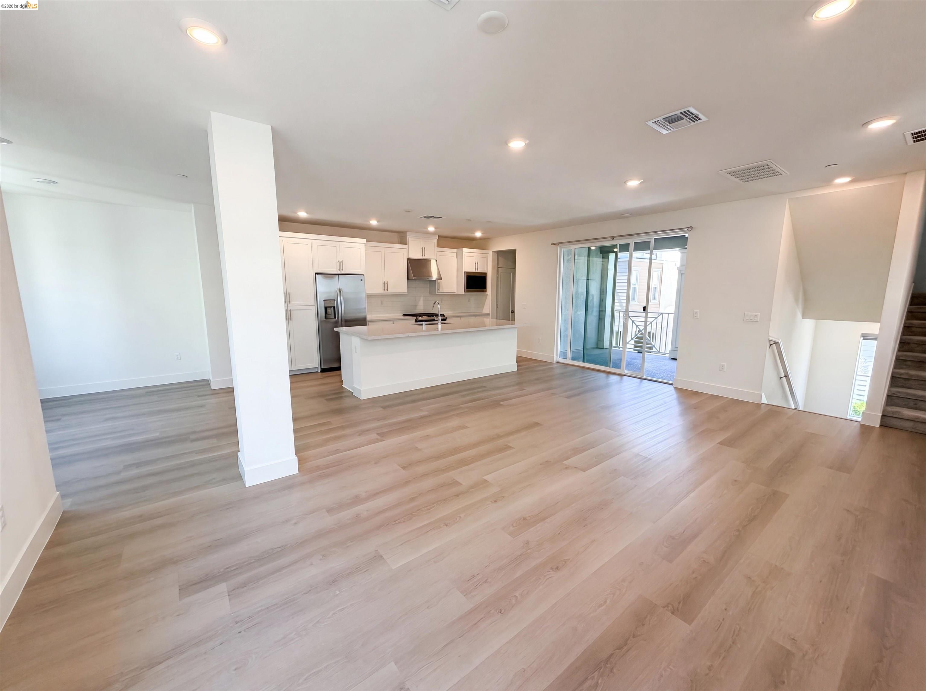 9034 Rudder Way Newark, CA 94560 - Photo 26 of 38 Spacious interior featuring wide plank wood-finish flooring throughout