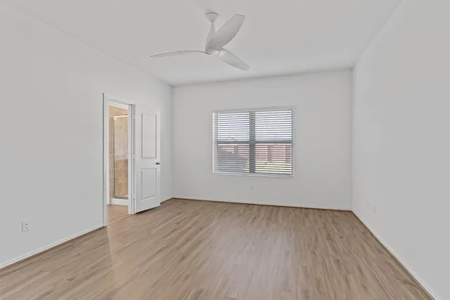 a view of kitchen with wooden floor and window
