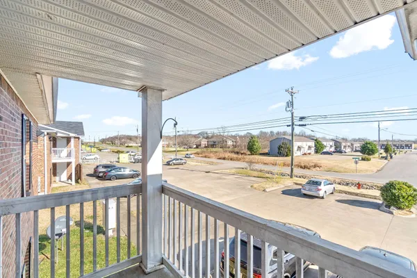 a view of a balcony with city view