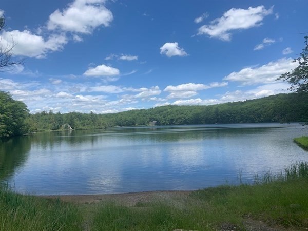 an aerial view of a house with a lake view