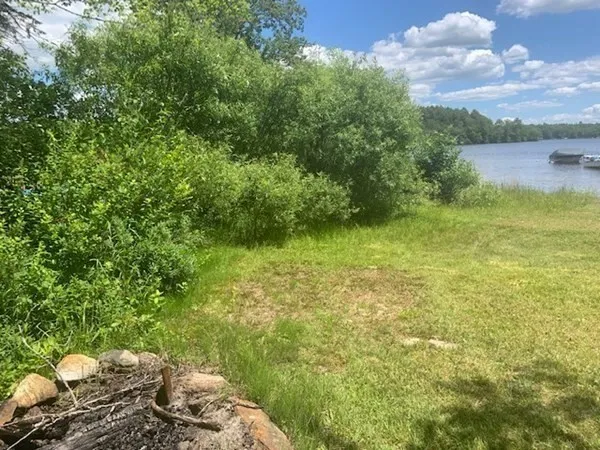 a view of a garden with an outdoor seating