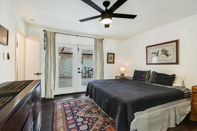 a bed room with a bed and a chandelier