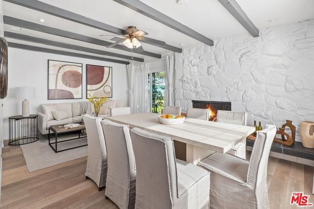 a dining room with furniture and a window