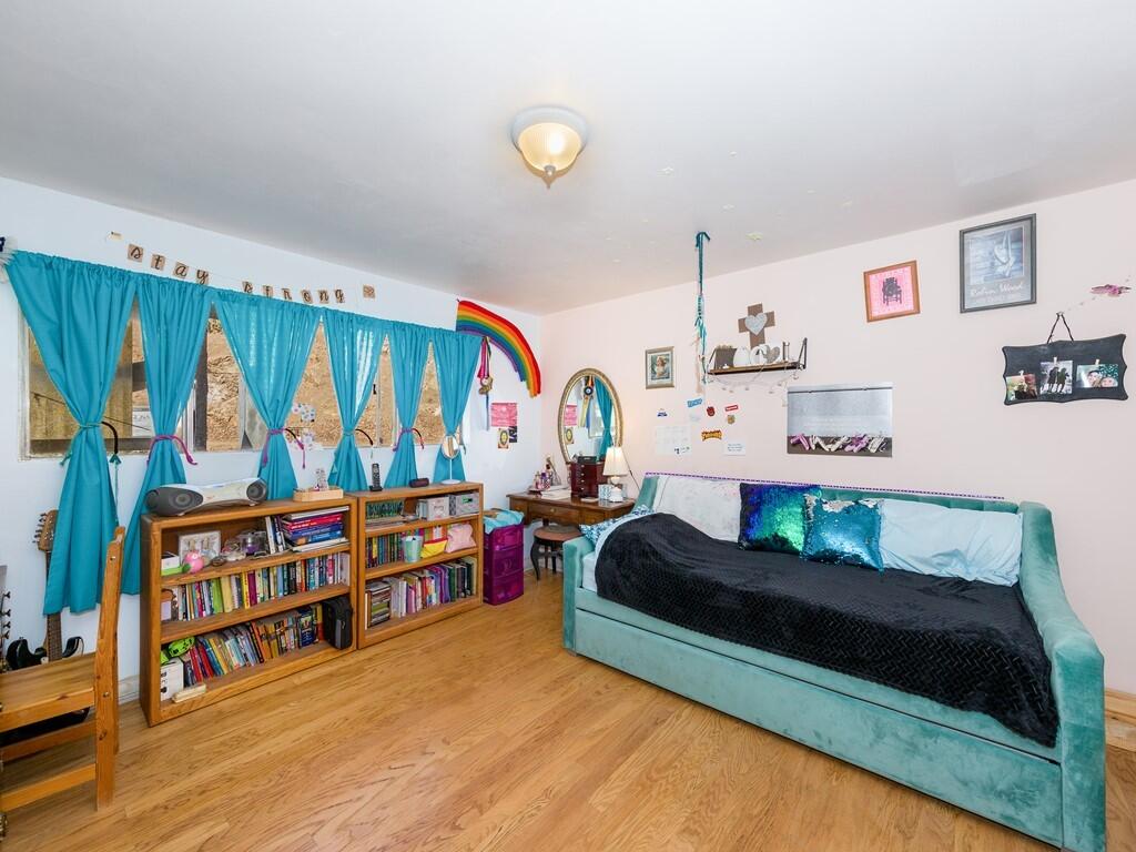 35269 Red Rover Mine Road Acton, CA 93510 - Photo 13 of 19 a bedroom with furniture and a book shelf