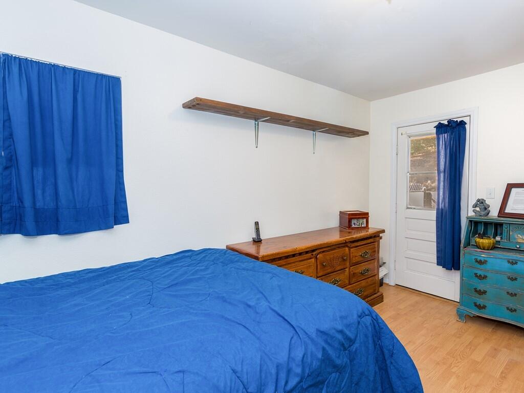 35269 Red Rover Mine Road Acton, CA 93510 - Photo 14 of 19 a bedroom with bed and wooden floor