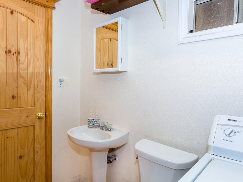 35269 Red Rover Mine Road Acton, CA 93510 - Photo 15 of 19 a bathroom with a toilet sink and mirror