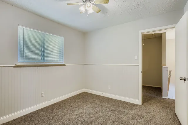 an empty room with a empty space and a window