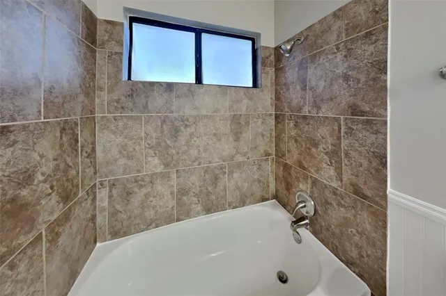 a bathroom with a bathtub