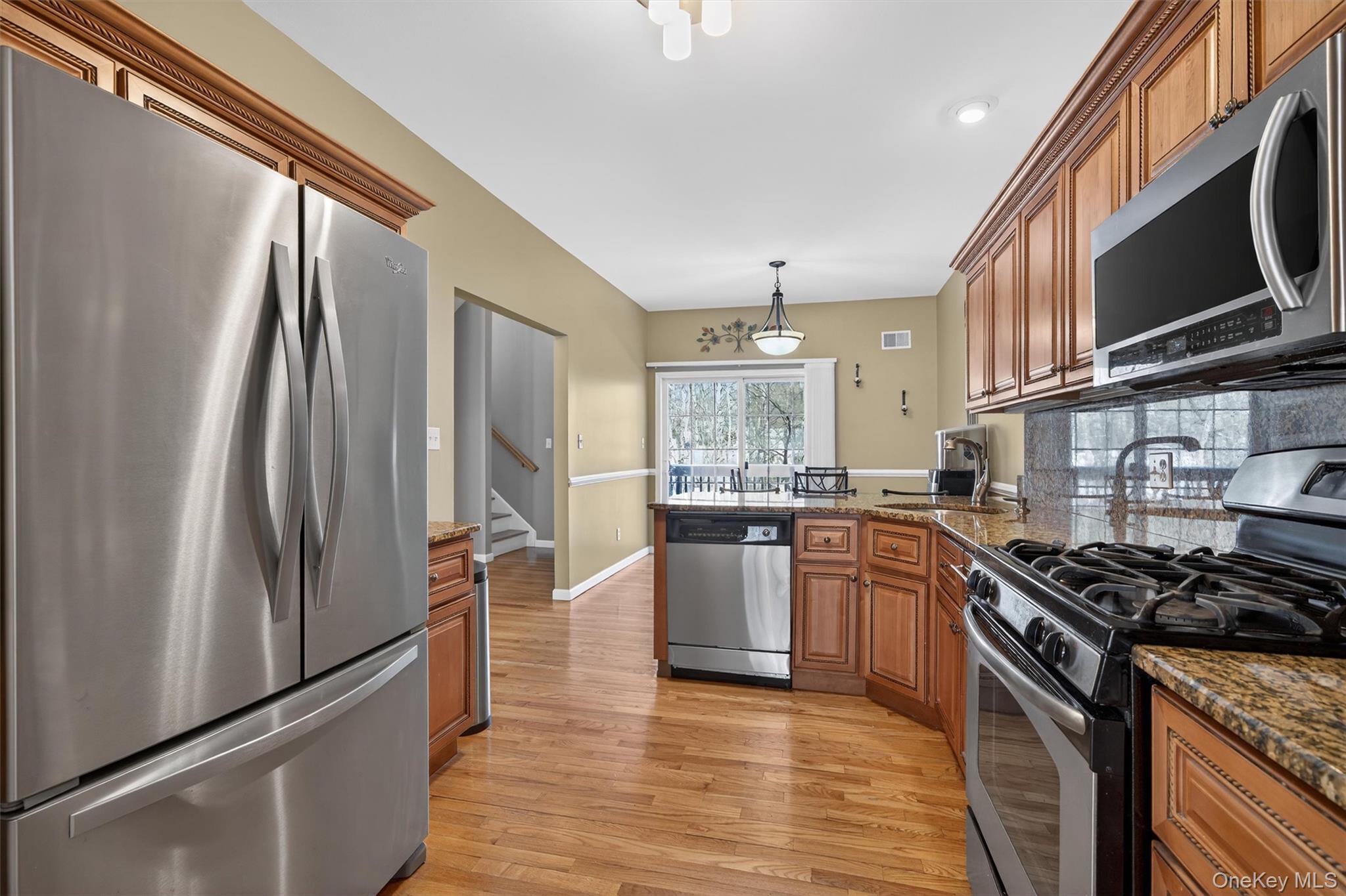 32 Peter Turner Road Monroe, NY 10950 - Photo 13 of 42 a kitchen with stainless steel appliances granite countertop a refrigerator stove and sink