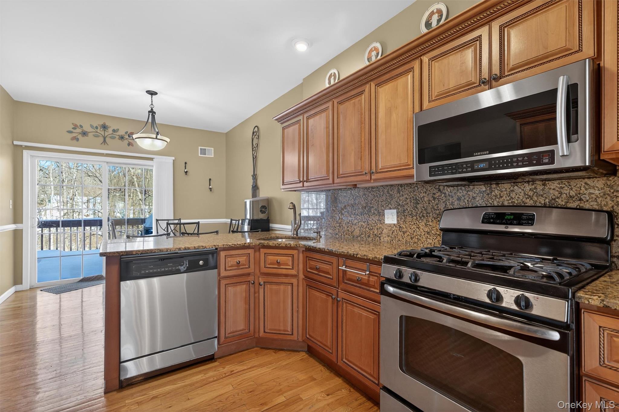 32 Peter Turner Road Monroe, NY 10950 - Photo 14 of 42 a kitchen with stainless steel appliances a stove a microwave a sink and cabinets