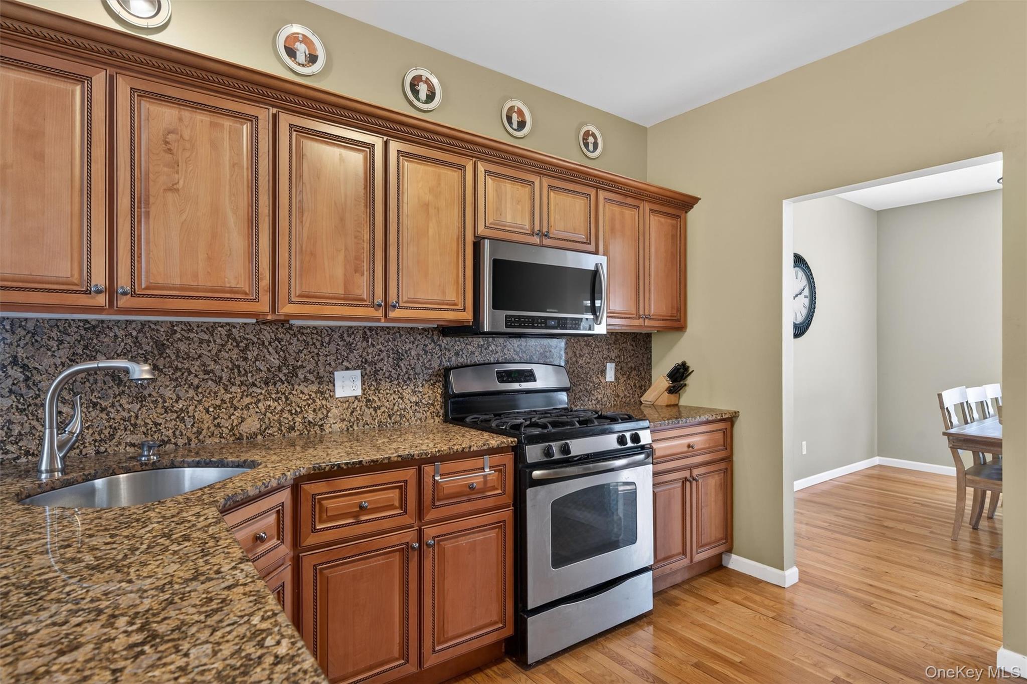 32 Peter Turner Road Monroe, NY 10950 - Photo 16 of 42 a kitchen with stainless steel appliances granite countertop a stove a sink and a microwave