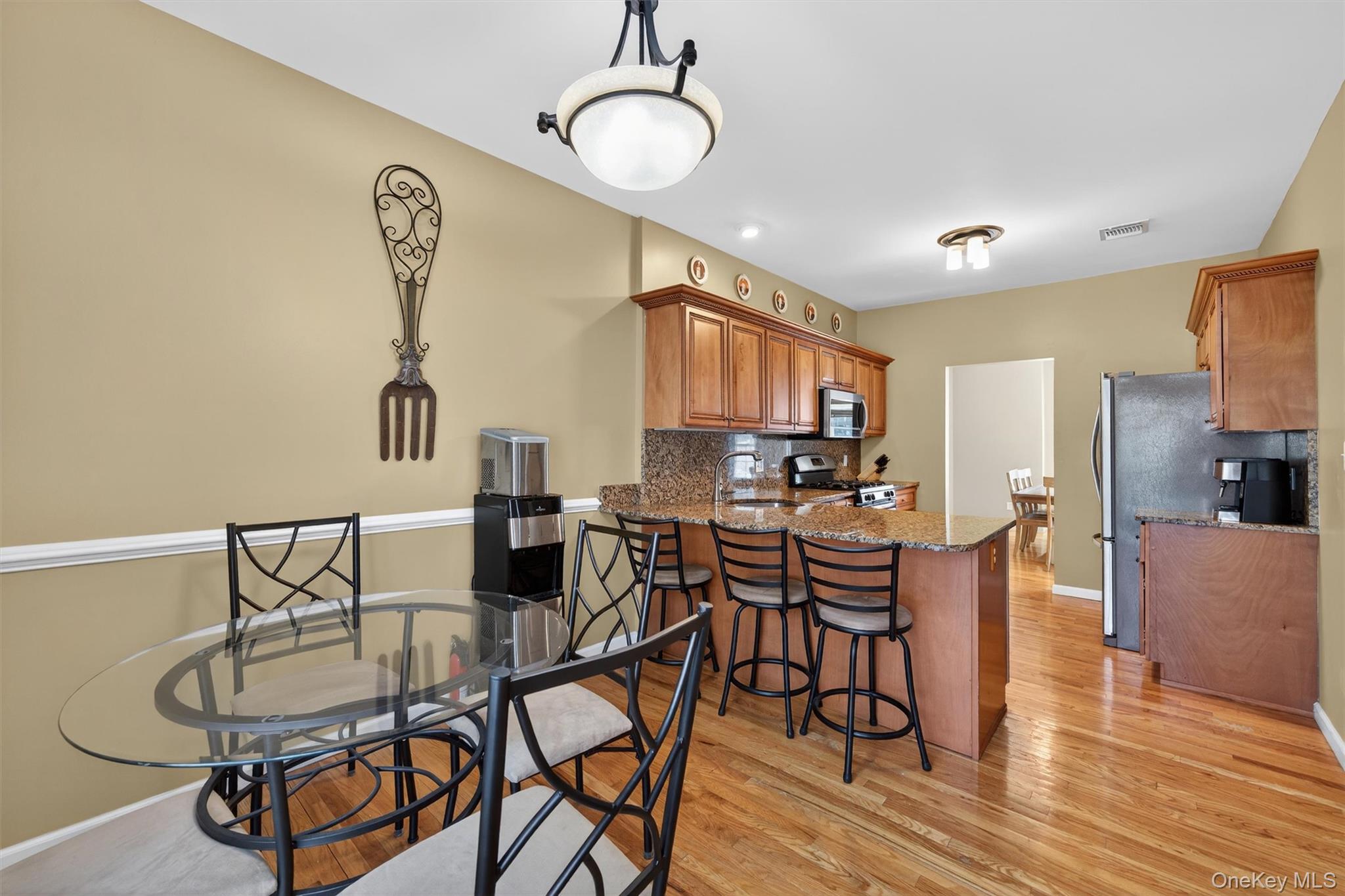 32 Peter Turner Road Monroe, NY 10950 - Photo 19 of 42 a view of a dining room with furniture and wooden floor