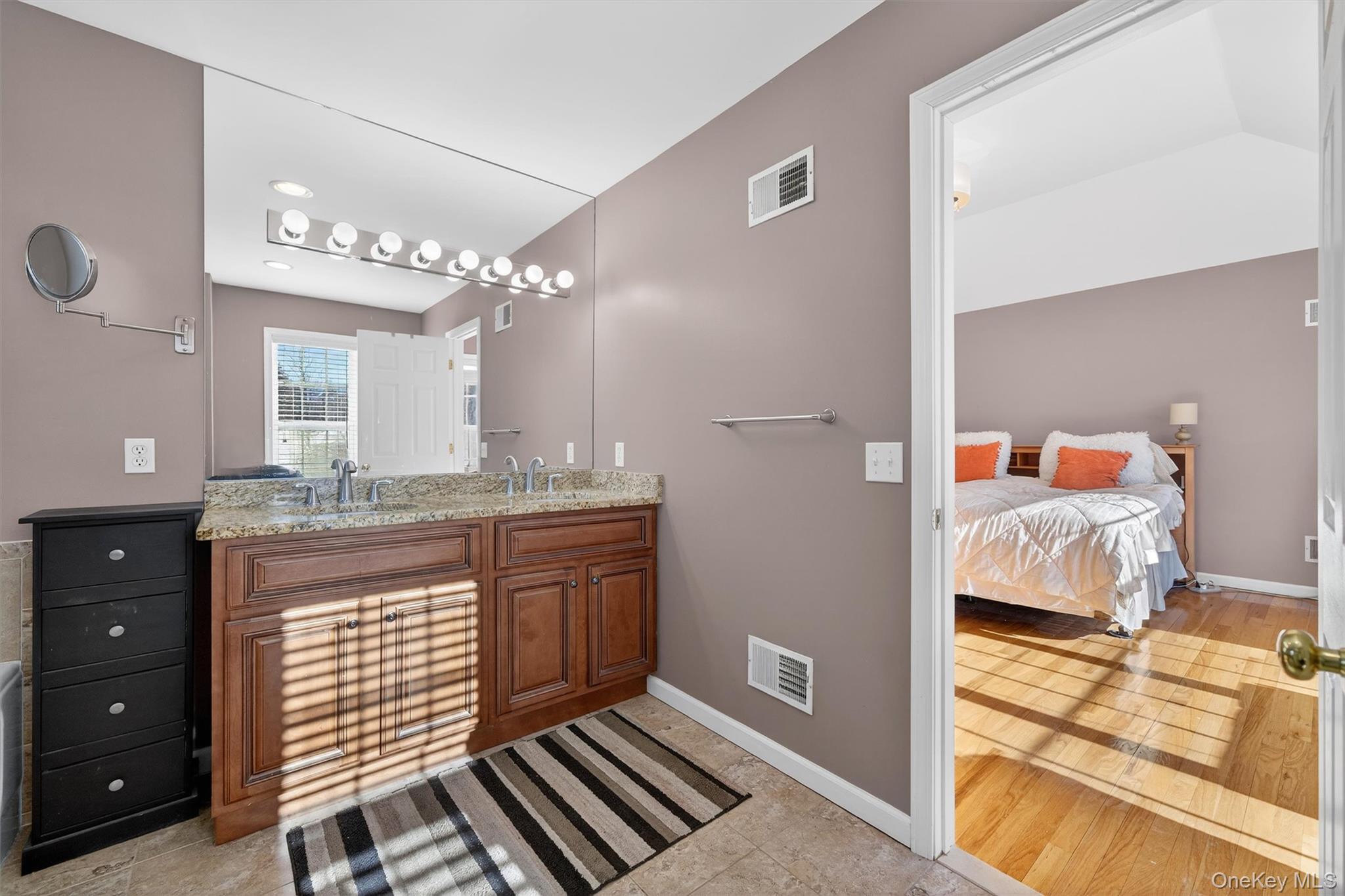 32 Peter Turner Road Monroe, NY 10950 - Photo 28 of 42 a en suite bathroom with a granite countertop sink and a mirror