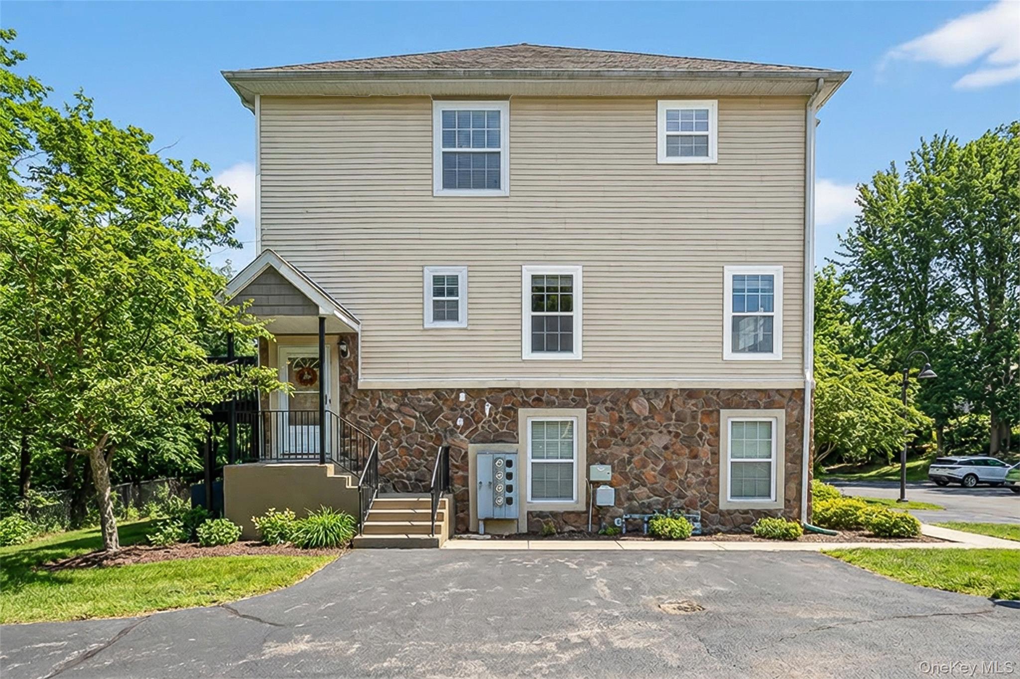 32 Peter Turner Road Monroe, NY 10950 - Photo 3 of 42 a front view of a house with a garden and plants