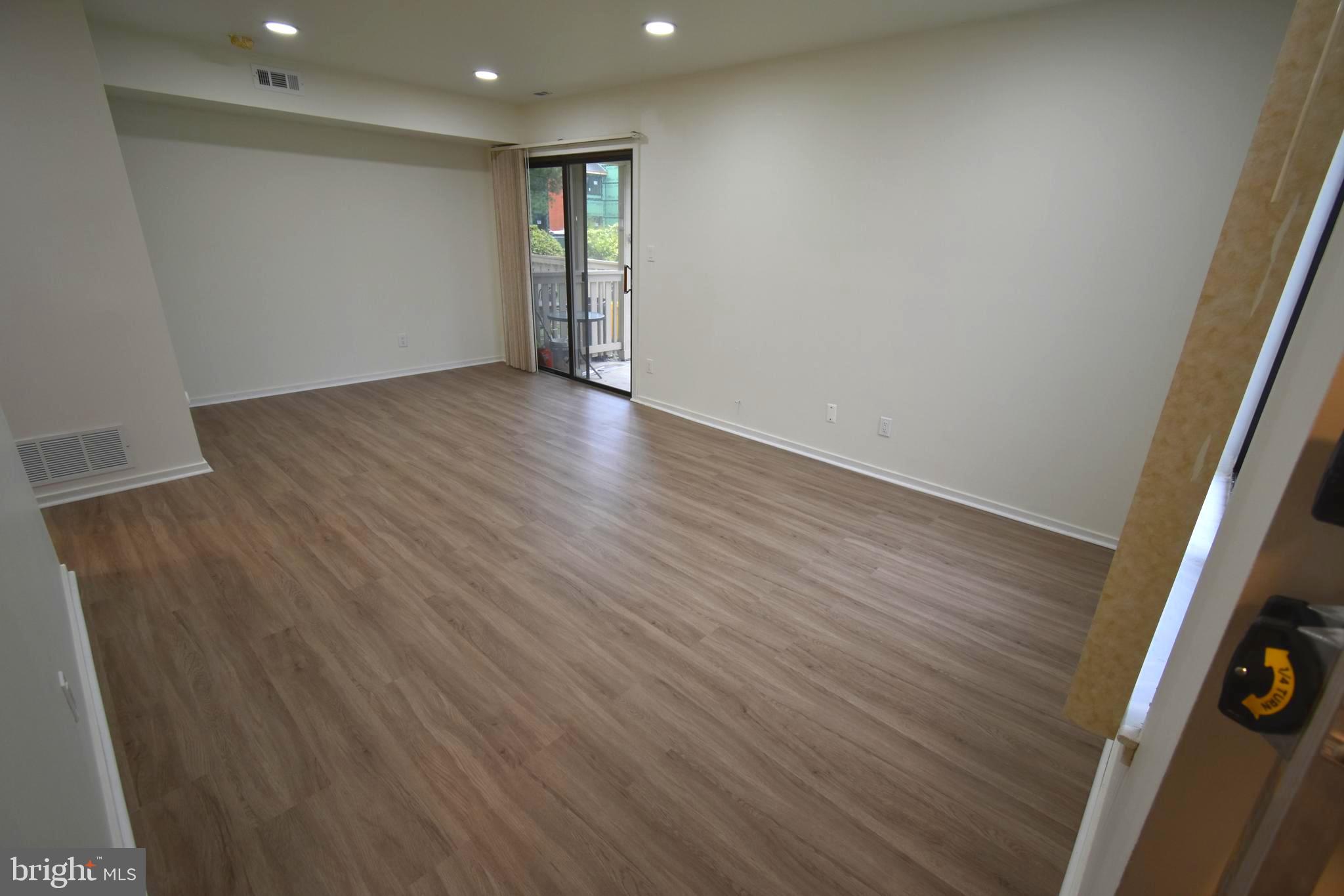 119 Sandra Road Voorhees, NJ 08043 - Photo 6 of 36 wooden floor in an empty room with a window