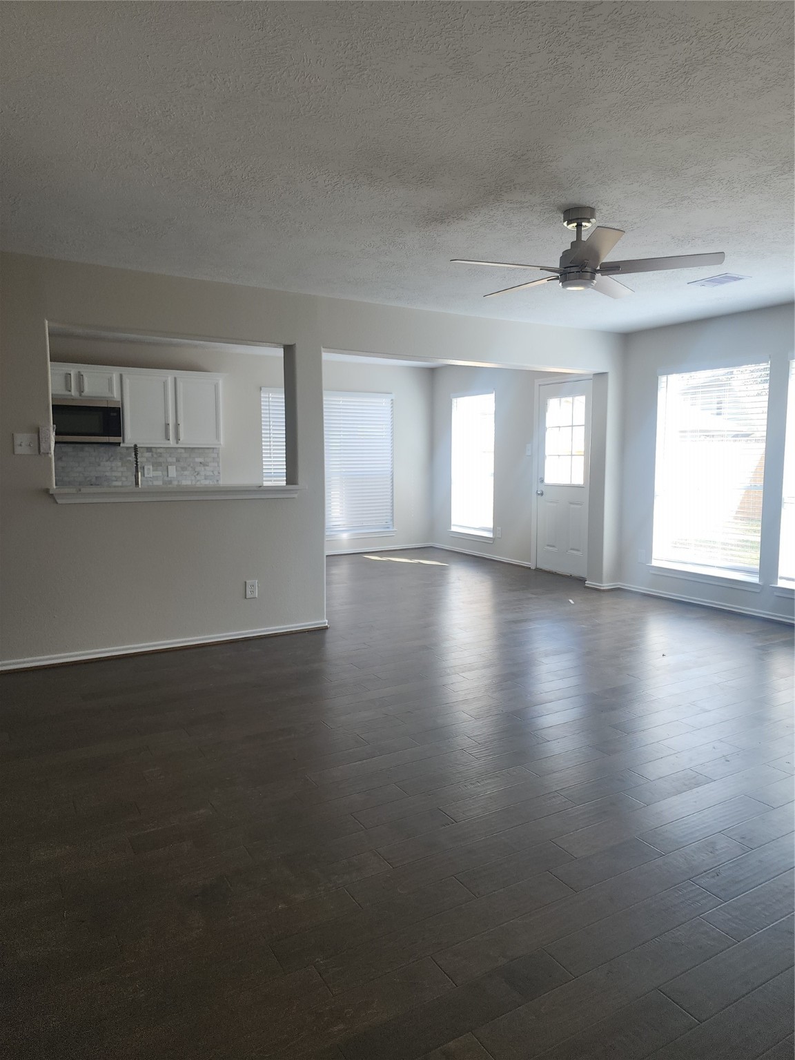 10614 Acacia Forest Trail Houston, TX 77089 - Photo 11 of 27 an empty room with wooden floor and windows