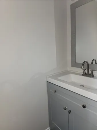 a bathroom with a sink and vanity
