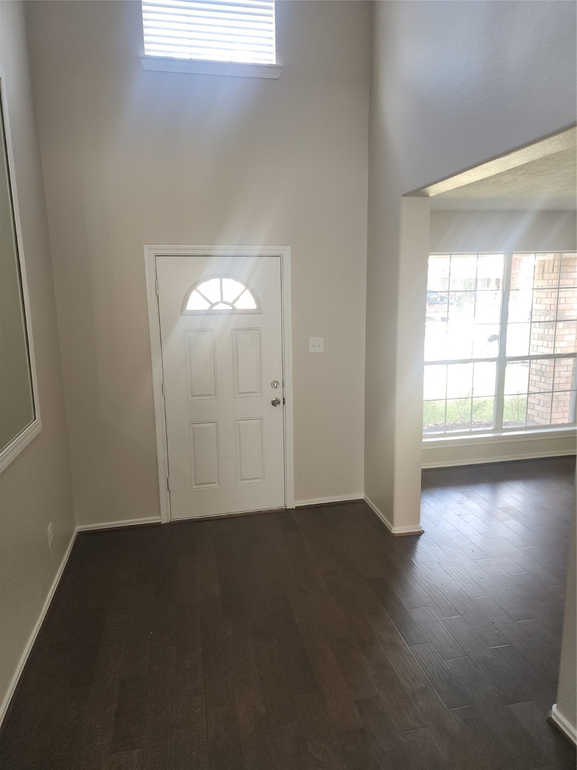 10614 Acacia Forest Trail Houston, TX 77089 - Photo 5 of 27 an empty room with wooden floor and windows