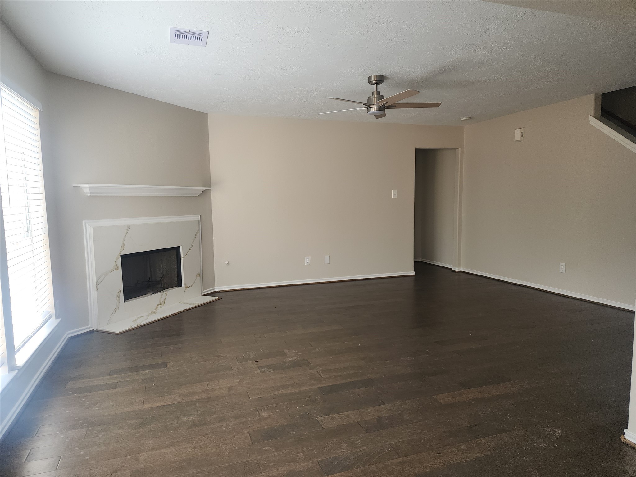 10614 Acacia Forest Trail Houston, TX 77089 - Photo 7 of 27 an empty room with windows and fireplace