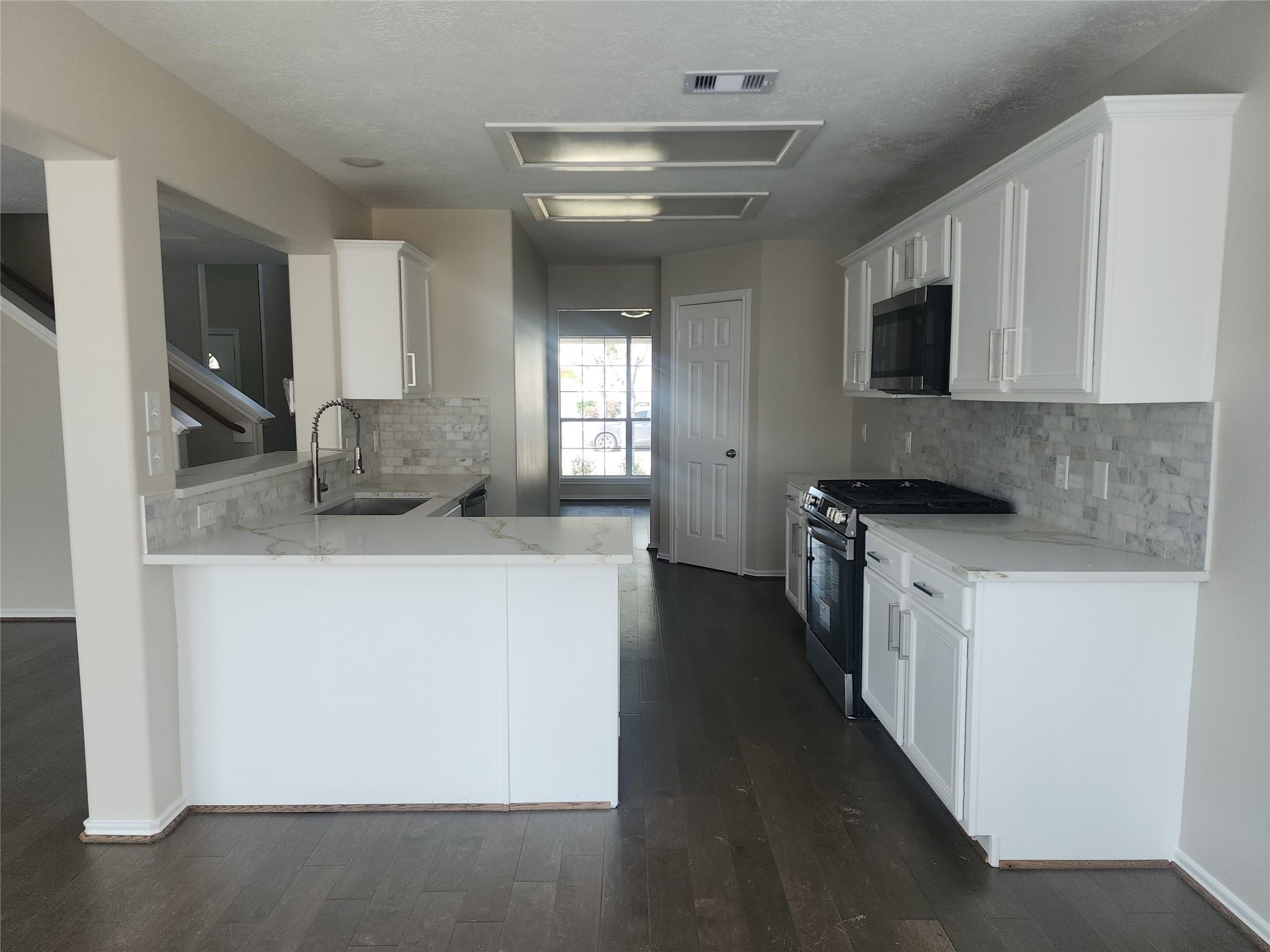 10614 Acacia Forest Trail Houston, TX 77089 - Photo 8 of 27 a kitchen with granite countertop a sink and a stove top oven