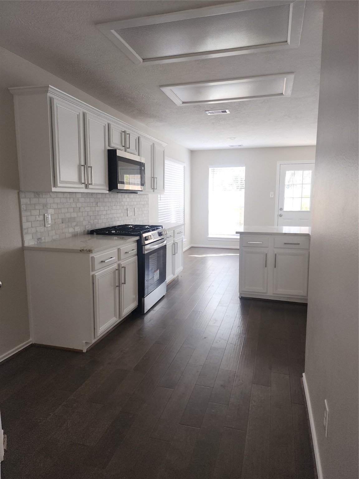 10614 Acacia Forest Trail Houston, TX 77089 - Photo 9 of 27 a kitchen with stainless steel appliances granite countertop a stove and a sink