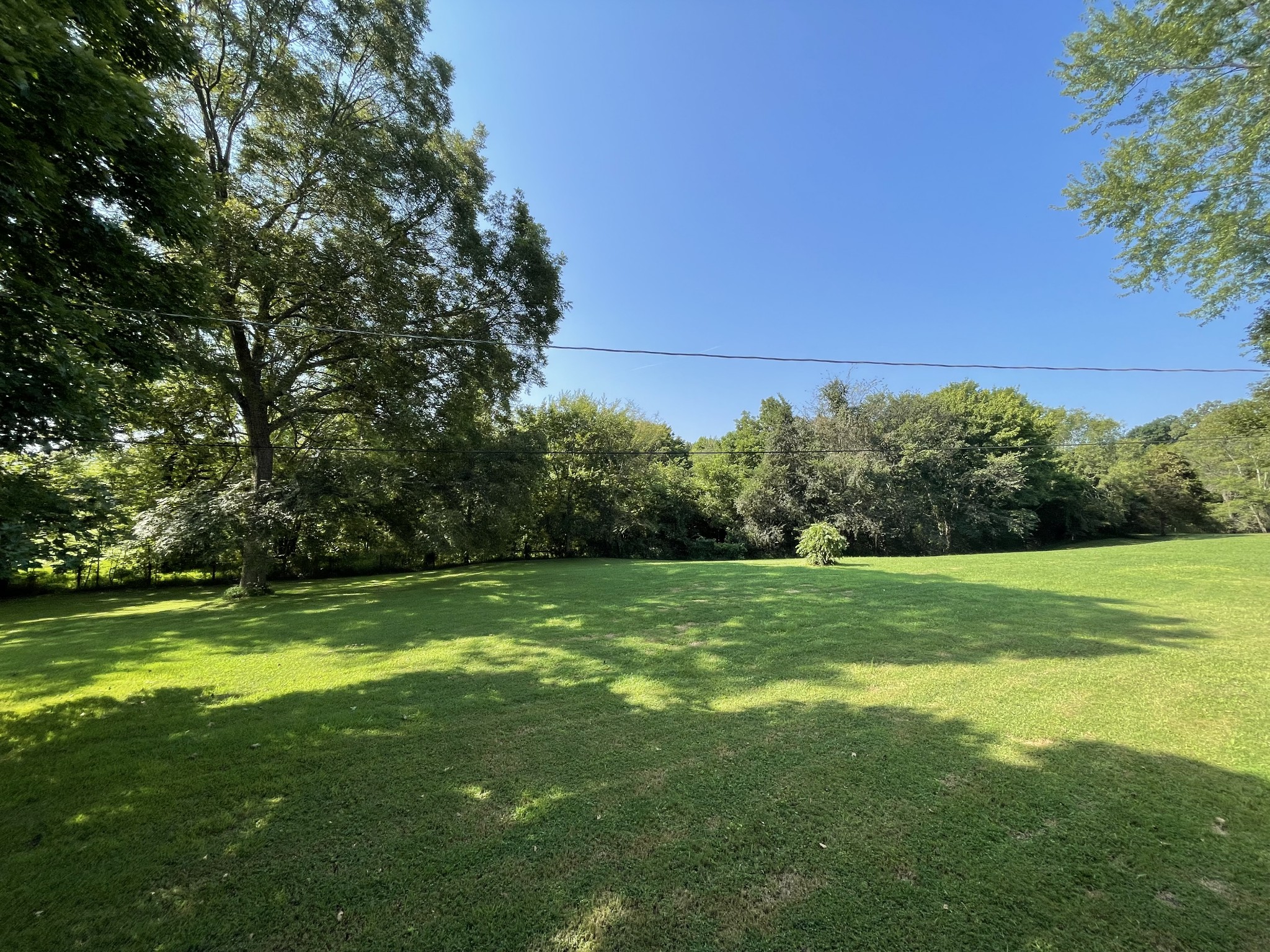 2870 Battle Creek Road Springfield, TN 37172 - Photo 16 of 48 a view of a grassy field with an trees