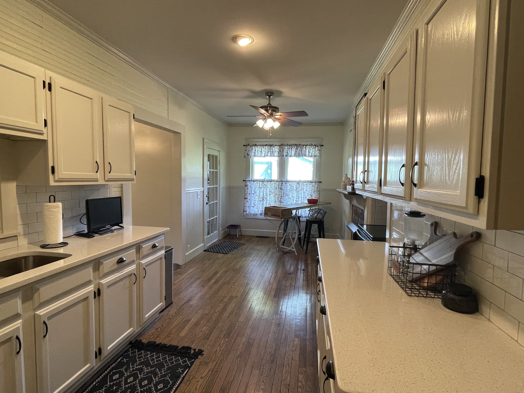 2870 Battle Creek Road Springfield, TN 37172 - Photo 27 of 48 a kitchen with sink cabinets and wooden floor