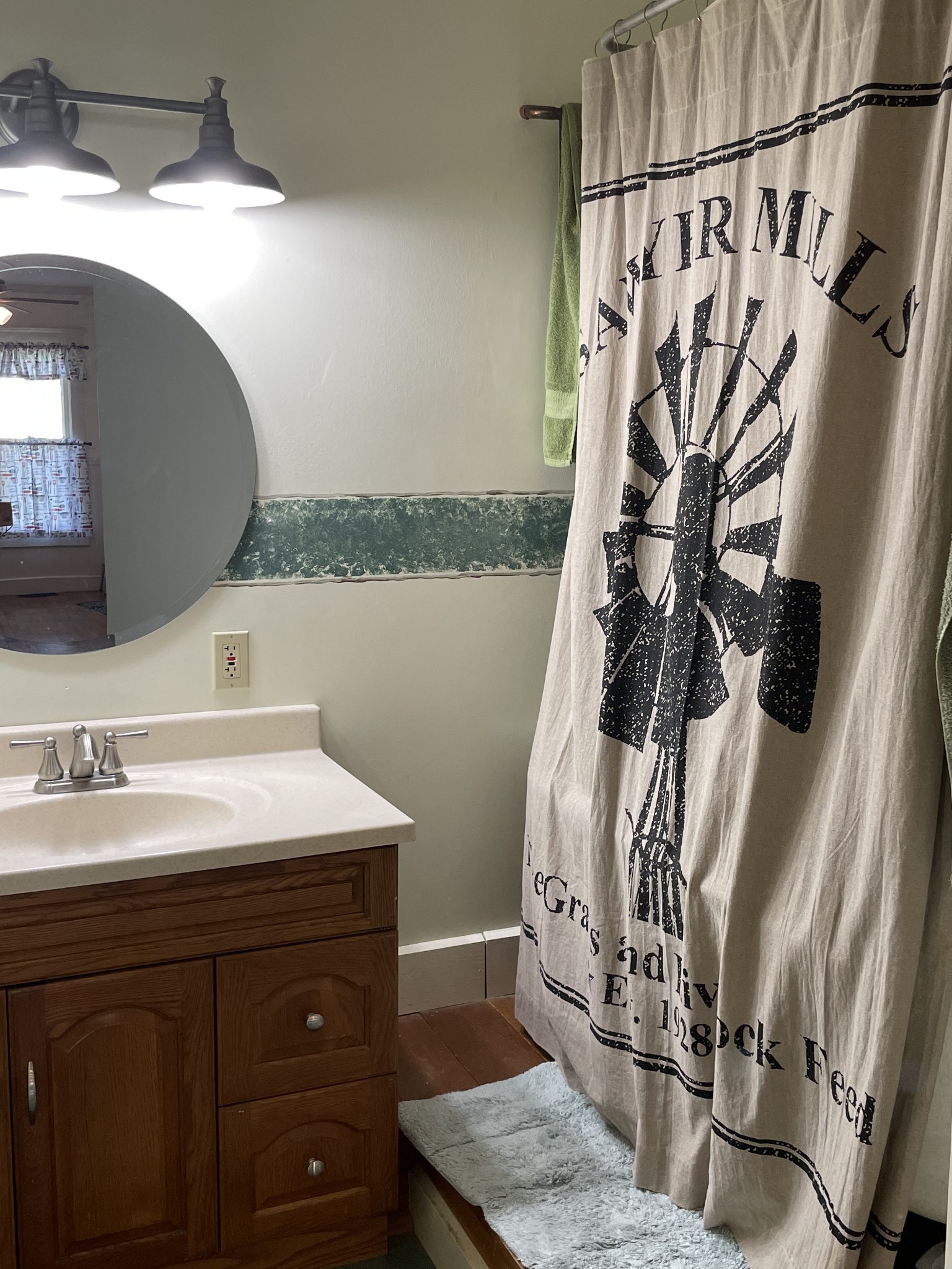 2870 Battle Creek Road Springfield, TN 37172 - Photo 36 of 48 a bathroom with a granite countertop sink a mirror and shower