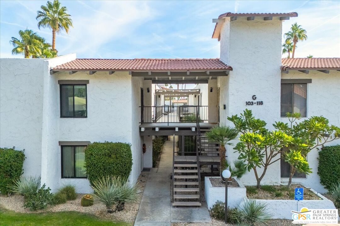 1050 Ramon Road, Unit 116 Palm Springs, CA 92264 - Photo 1 of 34 a front view of a house with garden