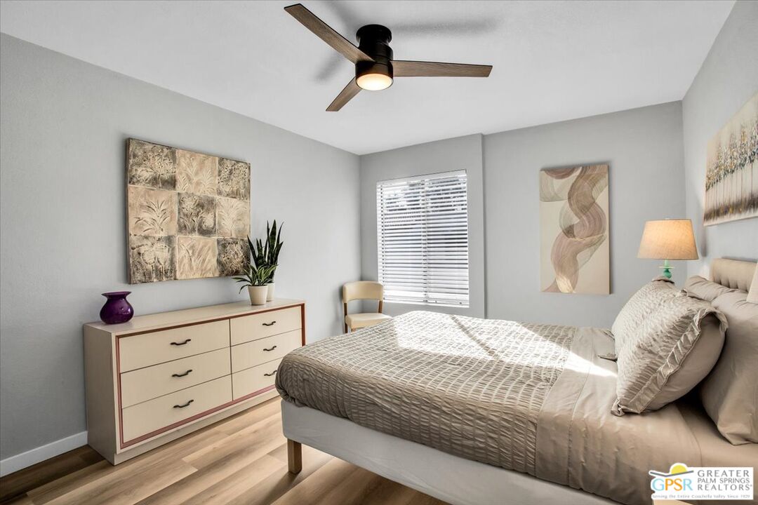 1050 Ramon Road, Unit 116 Palm Springs, CA 92264 - Photo 17 of 34 a bedroom with a bed and a window