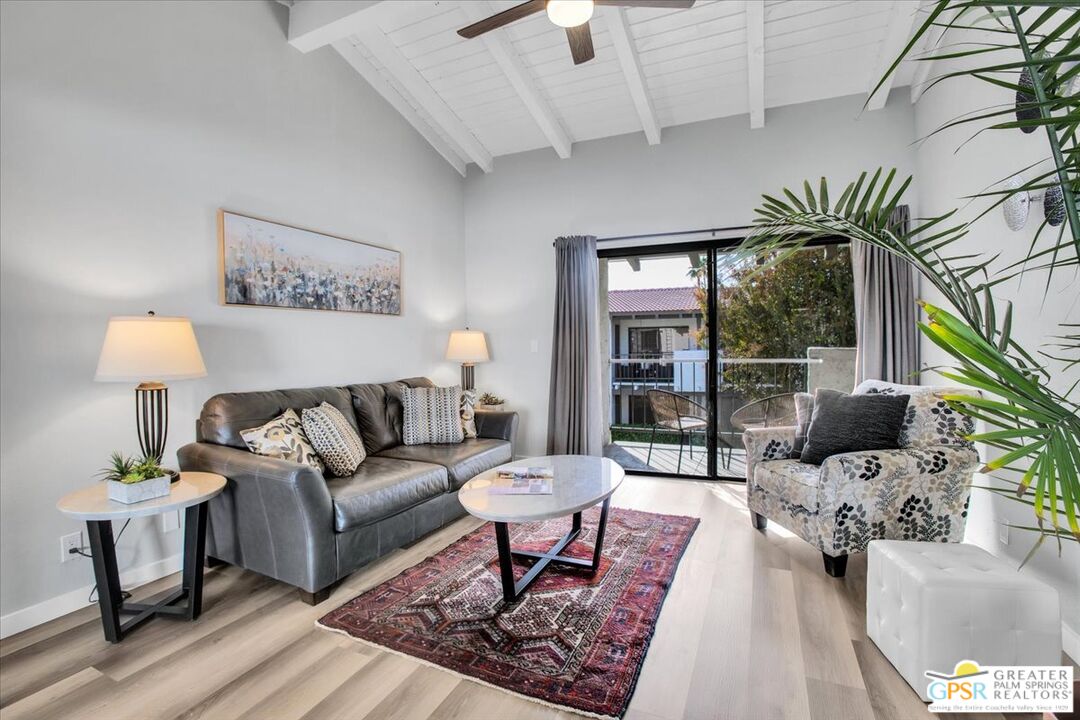 1050 Ramon Road, Unit 116 Palm Springs, CA 92264 - Photo 2 of 34 a living room with furniture and a potted plant