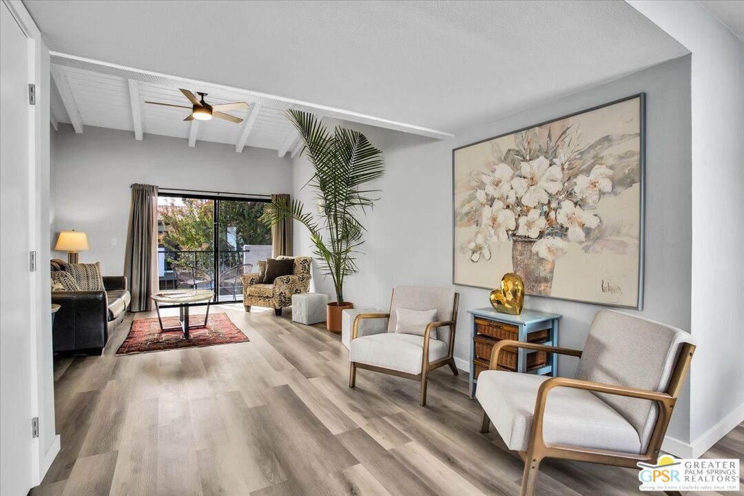 1050 Ramon Road, Unit 116 Palm Springs, CA 92264 - Photo 6 of 34 a living room with furniture and a wooden floor