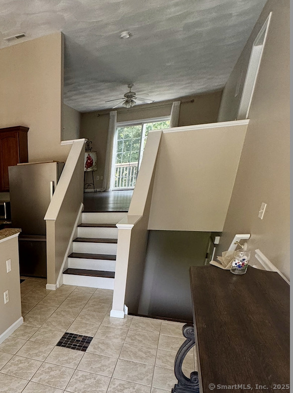 31 Marie Street, Unit B New Haven, CT 06513 - Photo 22 of 36 stairs up to living room, down to landing which leads to primary suite, garage and bonus room.