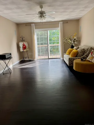 a living room with hard wood floor