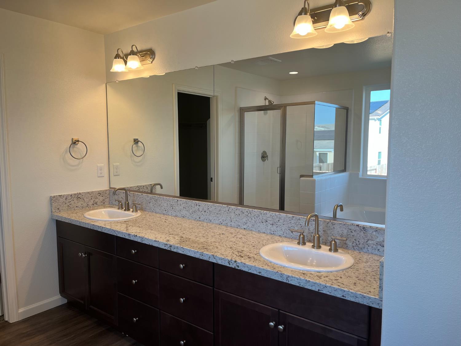 1189 Magnolia Court West Madera, CA 93636 - Photo 4 of 5 a bathroom with a sink double vanity and a mirror